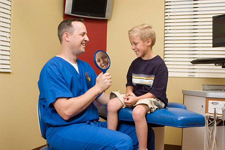 Boy Smiling with Dr. Johnson at the Pediatric Dentist Office in Casa Grande, Mesa and Chandler, AZ