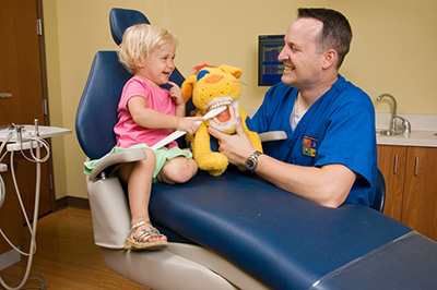 Doctor with child at the Pediatric Dentist Office in Casa Grande, Mesa and Chandler, AZ